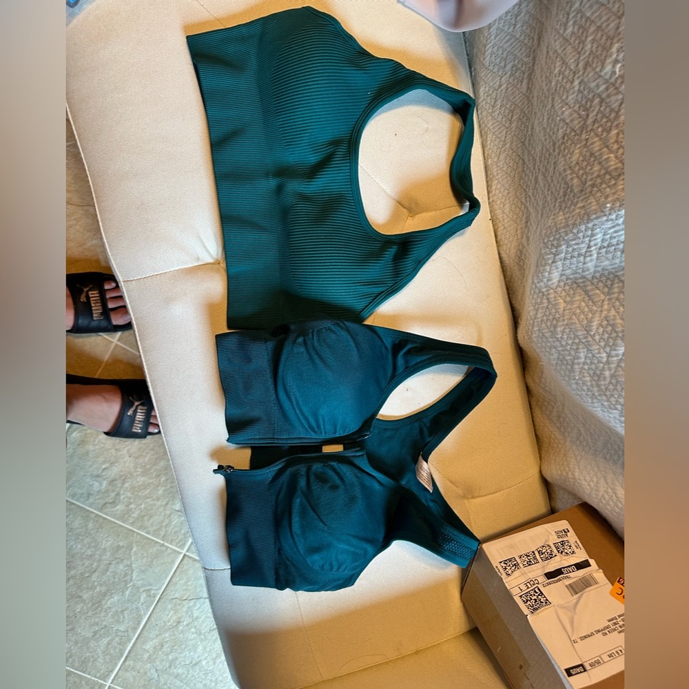 Two teal sports bras